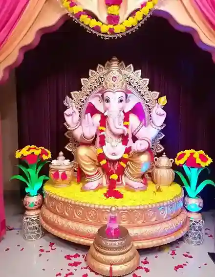 Royal Ganpati pandal decoration with yellow flowers and golden elements | Royal Ganpati Pandal with Floral Accents | Festival Decorations | Decorations Guru